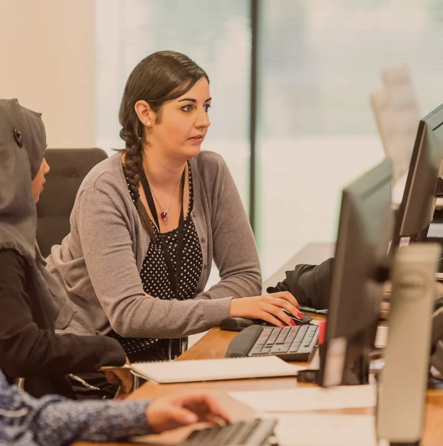 Woman working at a computer in an office
