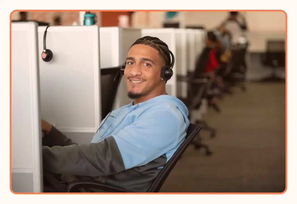 A VoiceTeam agent at a workstation on the contact center floor