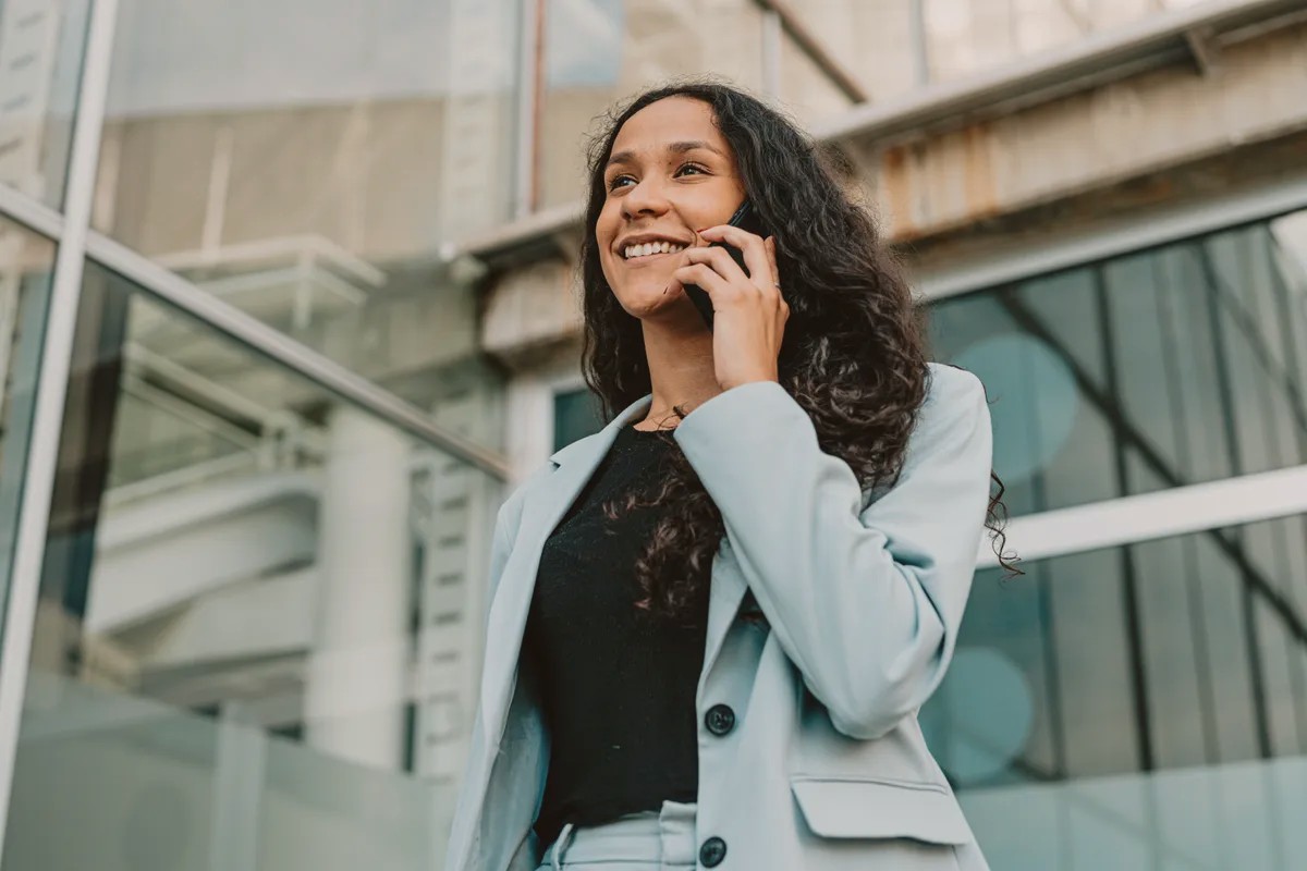 Woman smiling while talking on a mobile phone