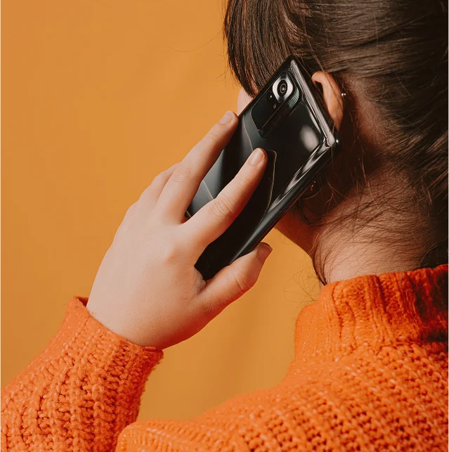 Close-up of a woman holding a mobile phone to her ear