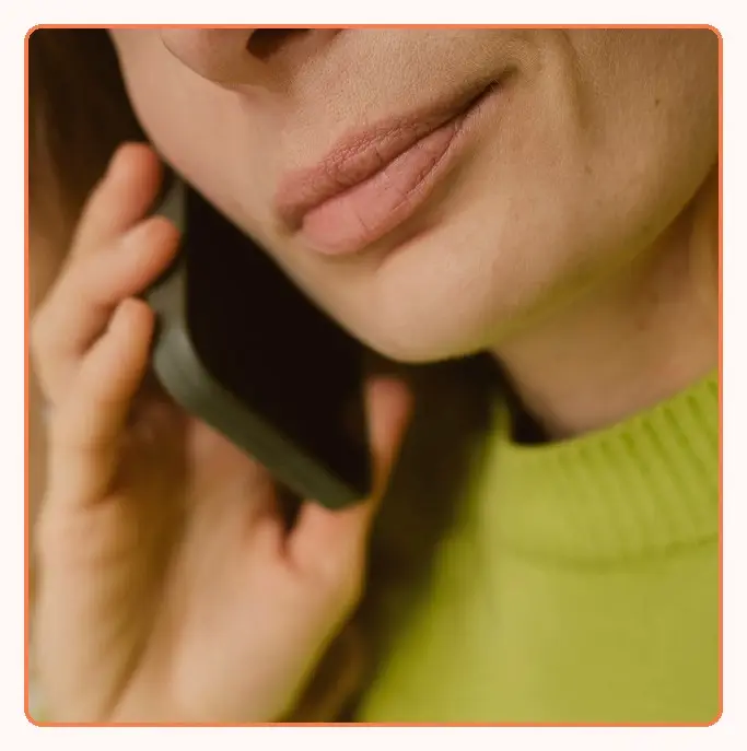 A close-up of a person talking on a mobile phone