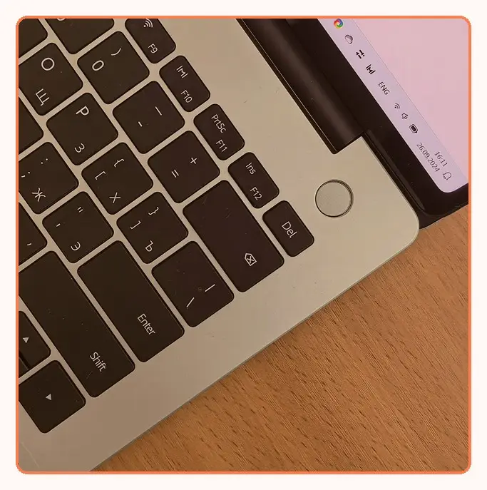 A laptop open on a desk