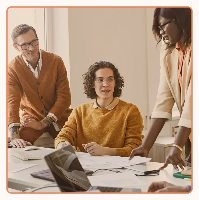 A team discussing work around a meeting table