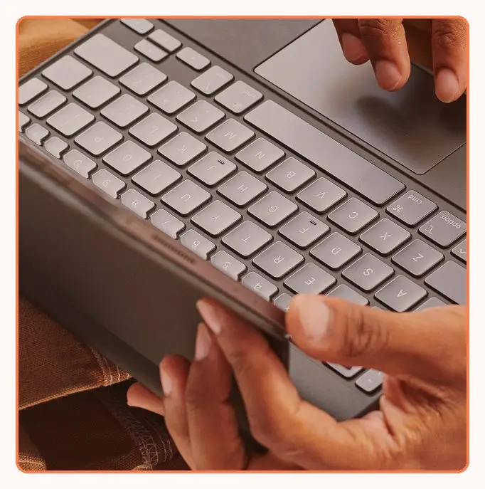 Hands typing on a tablet keyboard case