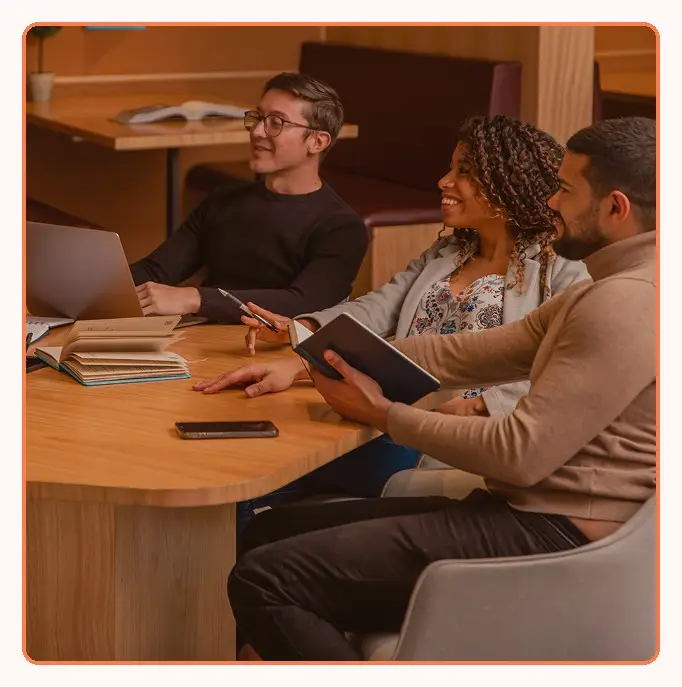 A small team in discussion around a table
