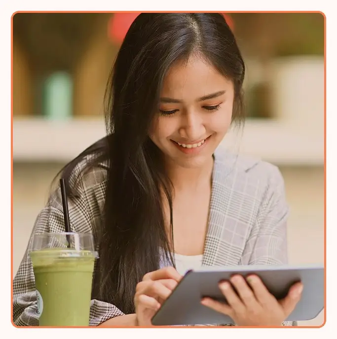 A customer using a tablet in a cafe